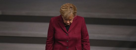 (FILE) +++ NEWS- UND ENTERTAINMENTFOTOS DER WOCHE +++ BERLIN, GERMANY - OCTOBER 15: German Chancellor Angel Merkel walks into the plenary hall at the Bundestag during debates that centered on Germany's refugee policy on October 15, 2015 in Berlin, Germany. Merkel gave a government declaration in which she reiterated her refugee policy stance prior to an upcoming European Union summit in Brussels. The Bundestag also voted later in the day on a new packet of measures to deal with the challenge of accommodating so many migrants and refugees this year. Merkel has coming under increasing pressure, including from members of her own political party, the German Christian Democrats (CDU), from critics who argue Germany is unable to cope with so many newcomers. Germany is expected to receive up to a million or more migrants this year. (Photo by Sean Gallup/Getty Images)